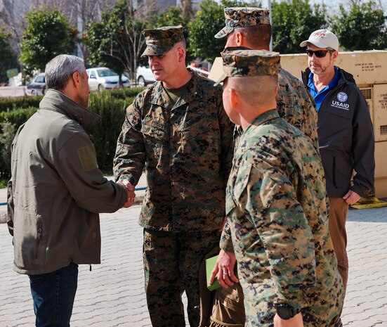 Brigadier Gen. Andrew T. Priddy, commanding general, Task Force 61/2, and a member of U.S. Agency for International Development (USAID) greet a member of the Turkish Ministry of Health, at Antakya, Türkiye, March 2, 2023. At the request of the Turkish government, U.S. military personnel assigned to Task Force 61/2 and 39th Air Base Wing were tasked with building a field hospital for the citizens who were affected by the Feb. 6 earthquakes. Upon completion of their efforts on March 2, 2023, leaders from Task Force 61/2 (TF 61/2), and 39th Air Base Wing conducted a final walk-through before the Turkish Ministry of Health began operations at the field hospital.