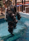 A new concept suit being raised out of the test pool after the Deep Sea Expeditionary with No Decompression (DSEND) Suit In-Water Concept Demonstration held at the U.S. Navy Experimental Diving Unit, Feb. 7 – 8. This new concept would enhance a diver’s range of motion while providing the added benefit of allowing the user to swim independent of propulsion systems. (U.S. Navy photo by Anthony Powers)