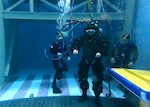 A Navy diver tests the capabilities of a new concept suit during the Deep Sea Expeditionary with No Decompression (DSEND) Suit In-Water Concept Demonstration held at the U.S. Navy Experimental Diving Unit, Feb. 7 – 8. The concept aimed to innovate the previous Atmospheric Diving Suit by making it more flexible, lightweight and user friendly. (U.S. Navy photo by Ronnie Newsome)