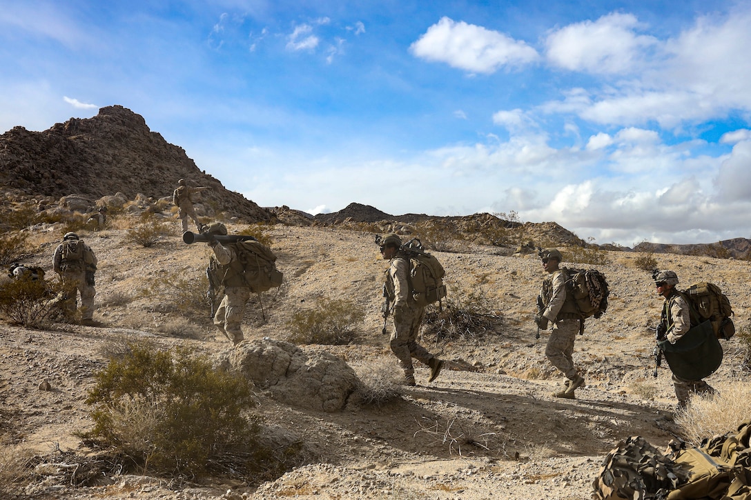US Marines hike towards an objective in the California desert