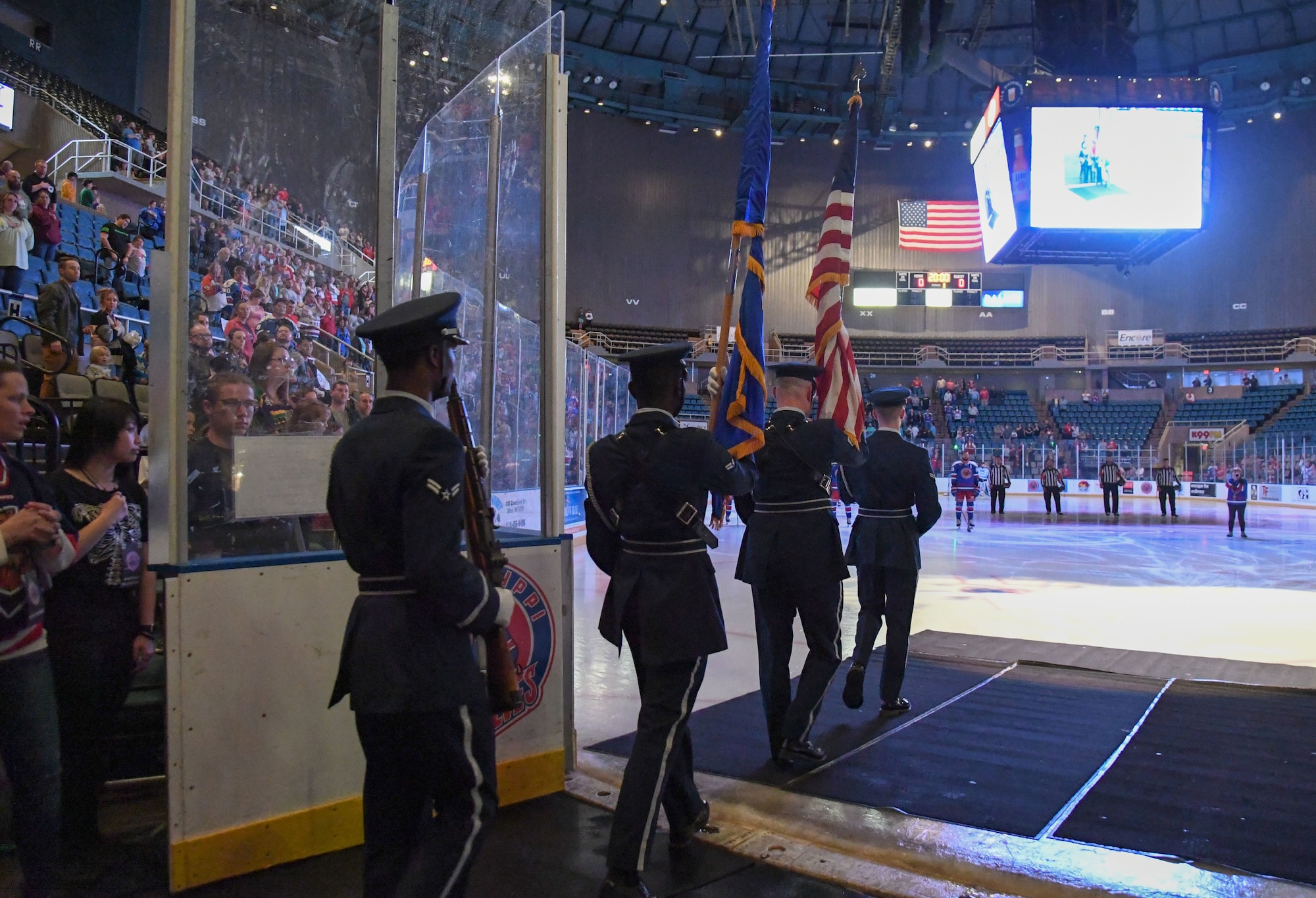 Keesler Air Force Base Honor Guard members enter the ice rink during the Biloxi Pro Hockey game inside the Mississippi Coast Coliseum at Biloxi, Mississippi, March 3, 2023.