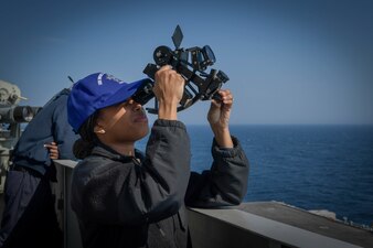 A Sailor uses a sextant aboard USS Dwight D. Eisenhower (CVN 69) in the Atlantic Ocean.