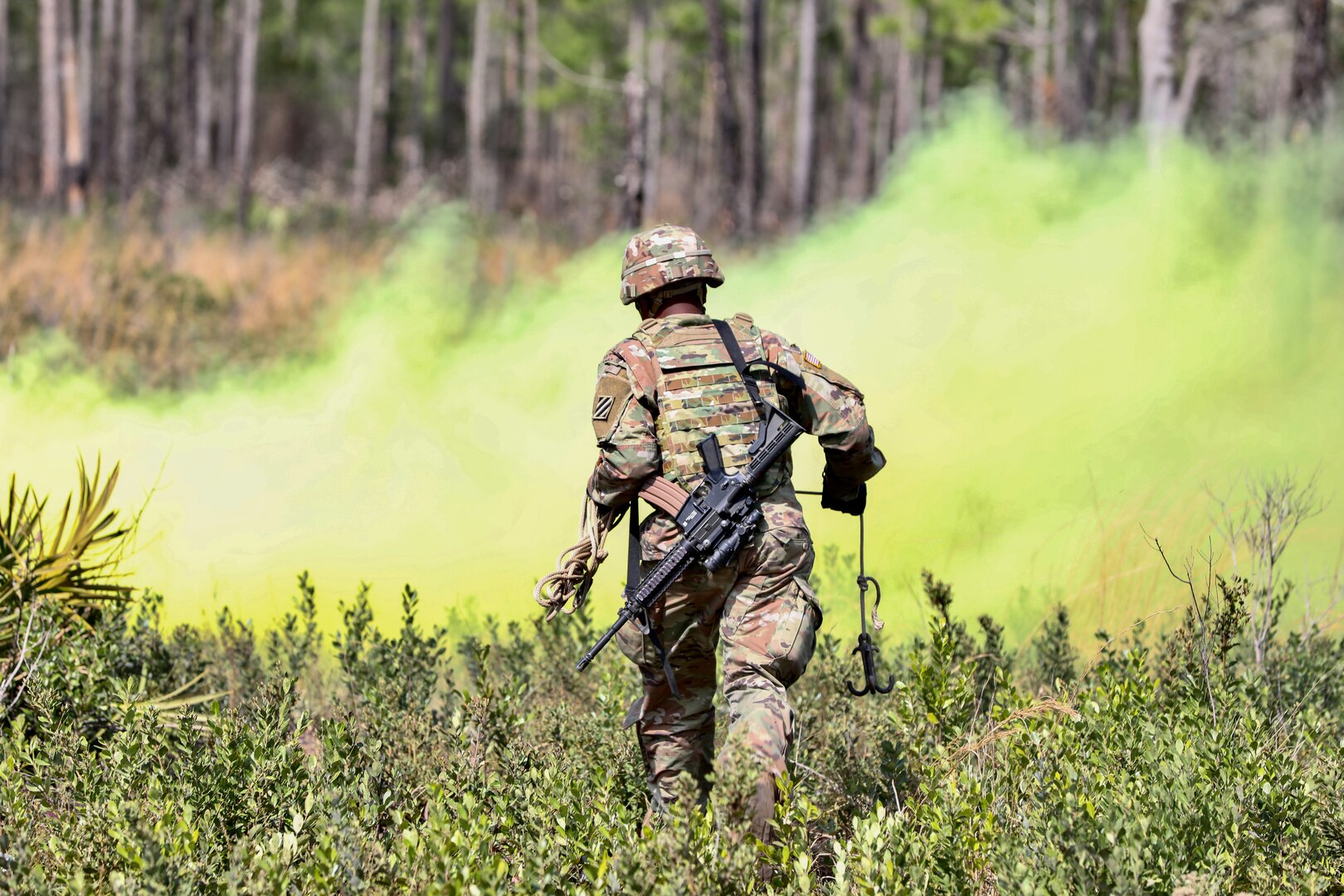 A Soldier from the Georgia Army National Guard's 177th Brigade Engineer Battalion prepares to breach an obstacle during a combined arms live-fire exercise in Fort Stewart, Ga., March 4, 2023. The exercise validated six infantry platoons and enabled the battalion to test its warfighting functions.