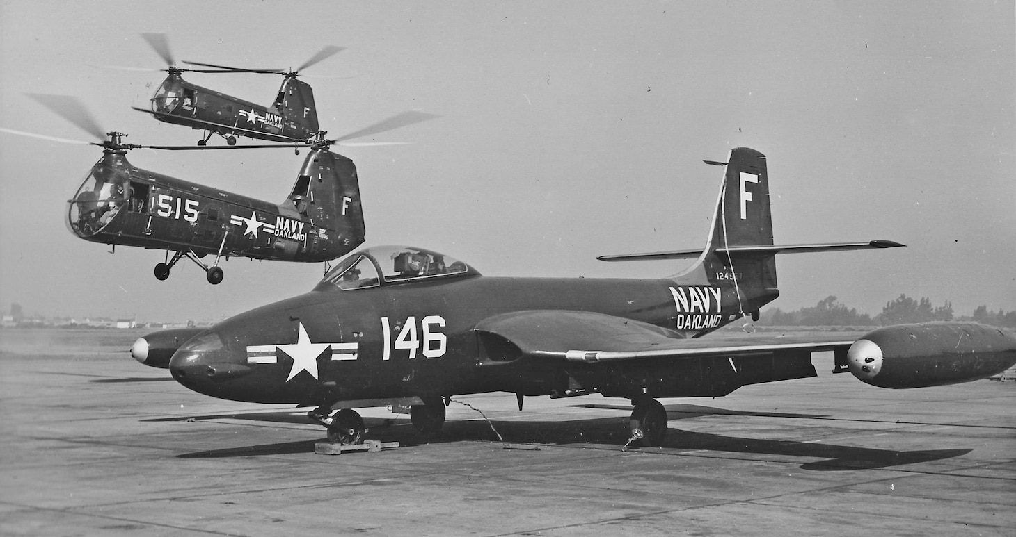 At Naval Air Station Oakland, near San Francisco, a Navy Air Reserve F2H-2 is joined by two HUP-2 helicopters assigned to the Naval Air Reserve Training Unit (NARTU). The reserves received several F2H-2s when the later F2H-3 and F2H-4 replaced them in the Fleet.