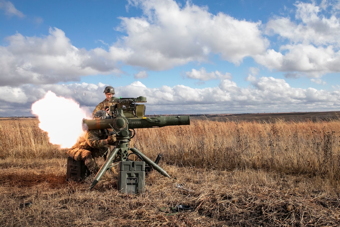 Soldiers with the Nebraska Army National Guard 1-134th Cavalry Squadron and 2-134th Infantry Battalion operate a TOW Missile System during a training exercise at Fort Riley, Kansas, Dec. 13, 2022.
