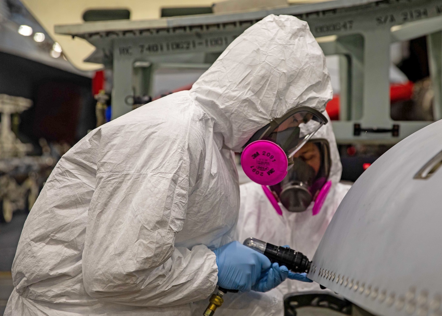 221216-N-IX644-1053 ADRIATIC SEA (Dec. 16, 2022) Michael Vallely, left and Daniel Wondering, assigned to Fleet Readiness Center Southwest, shave titanium grommets on the engine bay door of an F/-18E Super Hornet aircraft attached to Strike Fighter Squadron (VFA) 136, aboard the Nimitz-class aircraft carrier USS George H. W. Bush (CVN 77), Dec. 16, 2022. Carrier Air Wing (CVW) 7 is the offensive air and strike component of Carrier Strike Group 10, George H.W. Bush Carrier Strike Group (GHWBCSG). The squadrons of CVW-7 are VFA-86, VFA-103, VFA-136, VFA-143, Electronic Attack Squadron (VAQ) 140, Carrier Airborne Early Warning Squadron (VAW) 121, Helicopter Sea Combat Squadron (HSC) 5, and Helicopter Maritime Strike Squadron (HSM) 46. The GHWBCSG is on a scheduled deployment in the U.S. Naval Forces Europe area of operations, employed by U.S. Sixth Fleet to defend U.S., allied and partner interests. (U.S. Navy photo by Mass Communication Specialist Seaman Sasha Ambrose)