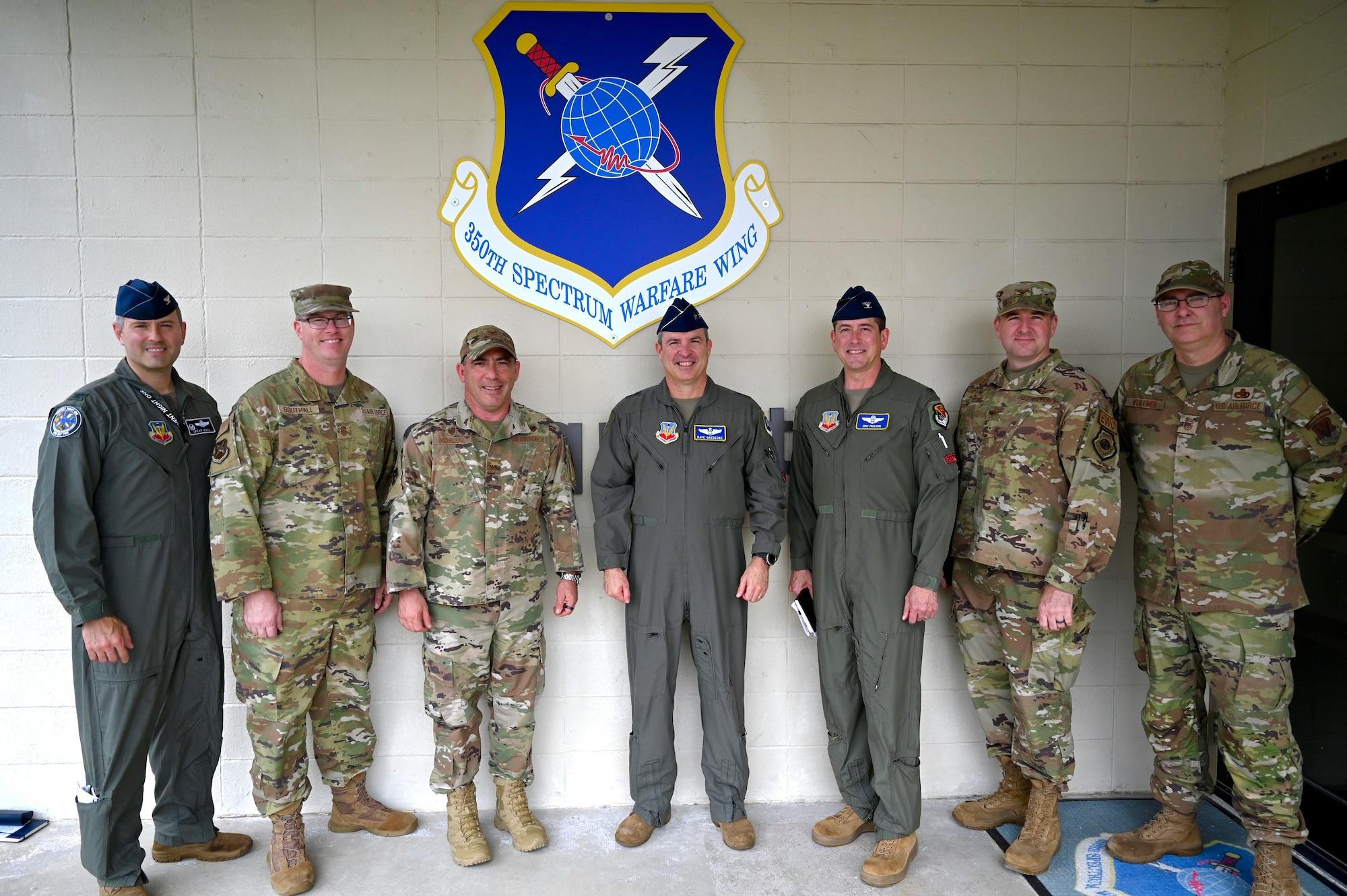 U.S. Air Force Maj. Gen. David Gaedecke, 16th Air Forces (Air Forces Cyber) vice commander, center, poses with leadership from the 350th Spectrum Warfare Wing during a visit at Eglin Air Force Base, Fla., March 1, 2023. Gaedecke visited to see how the wing's missions are providing the Combat Air Force with the electronic warfare capabilities needed to win. (U.S. Air Force photo by 1st Lt. Benjamin Aronson)