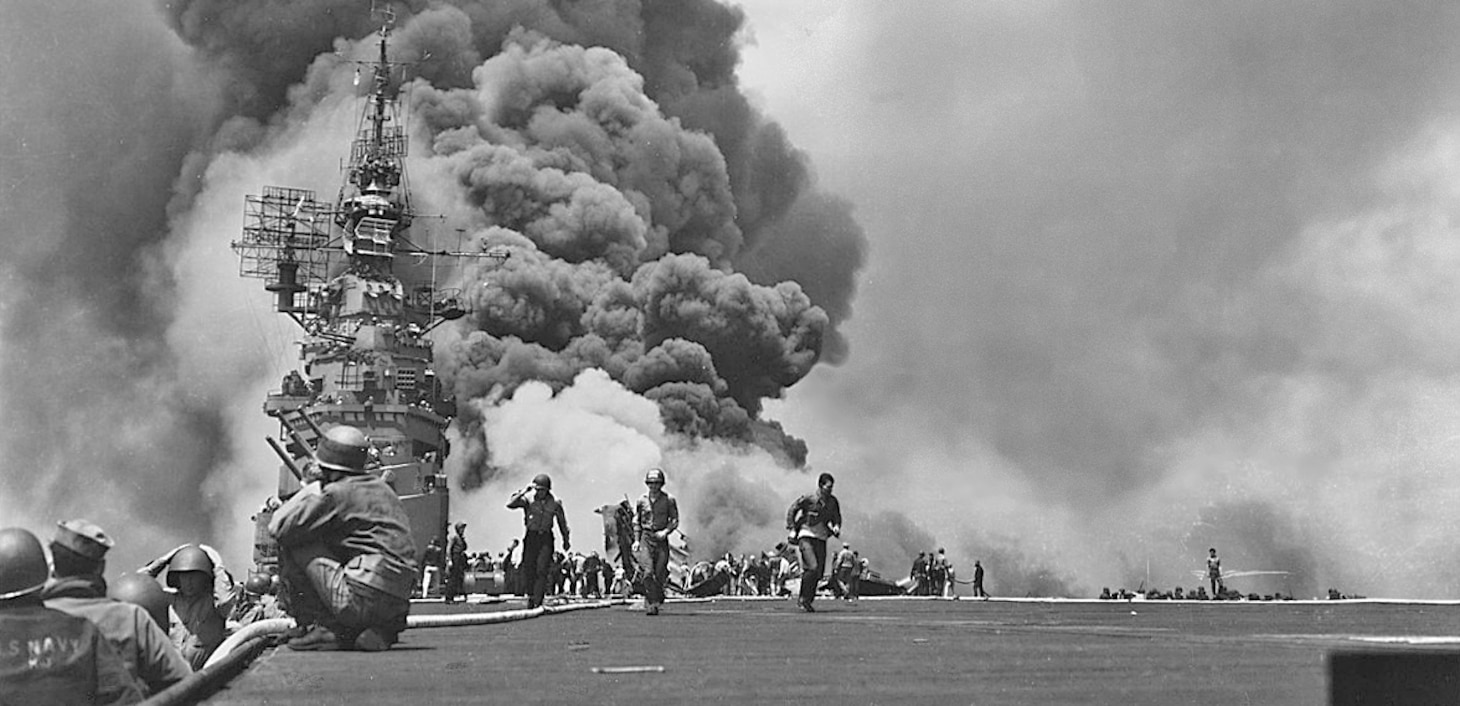 May 11, 1945, two Zero Kamikazes hit (within 30 minutes of each other) the carrier USS Bunker Hill (CV 17), resulting in huge columns of smoke over the aft flight deck. In one of the carrier’s ready rooms, 22  F4U Corsair pilots from Fighter Squadron (VF) 84 had just returned from a very dangerous mission. One of the Zeros’ bombs penetrated the flight deck into the ready room, killing 21 of the young aviators. In all, 393 of the carrier’s complement were killed and the ship was knocked out of the war.