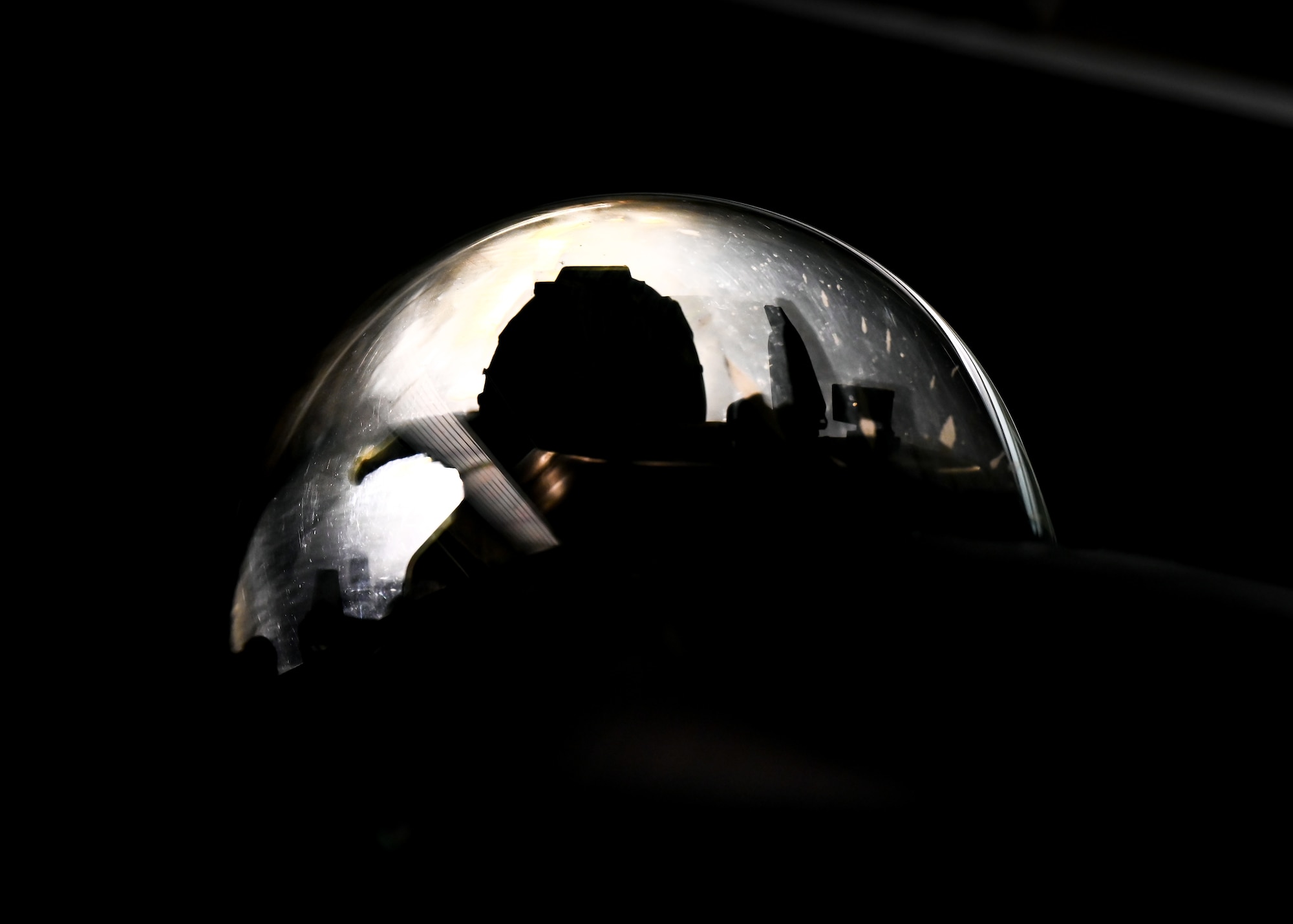 silhouette of a pilot in a cockpit