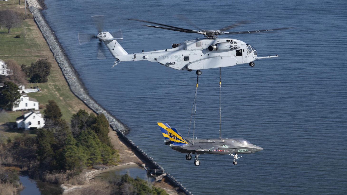A non-flyable F-35C Lightning II airframe is flown as part of a CH-53K King Stallion external load certification lift Dec. 13, 2022, at Naval Air Station Patuxent River, Maryland.