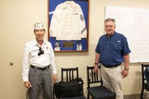 Ron Lam, left, first vice commander of the American Veterans of Hawaii, and Jim Brueckner, great nephew of Medal of Honor recipient U.S. Navy Chief Petty Officer John W. Finn, pose for a photo during a visit to Marine Corps Base Hawaii, Feb. 27, 2023. The visit provided a visual and historic understanding of the attacks that occurred on Naval Air Station Kaneohe Bay on Dec. 7, 1941, in which Finn’s acts of heroism earned him the Congressional Medal of Honor. (U.S. Marine Corps photo by Cpl. Chandler Stacy)