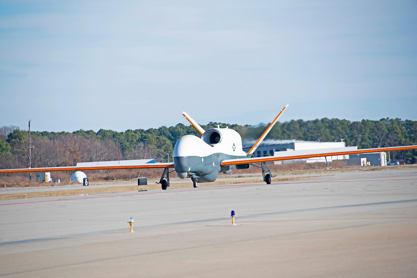 An MQ-4C Triton prepares for its initial flight to assess the unmanned aircraft system’s ability to fly with ice wing accumulation Jan. 25 at Naval Air Station Patuxent River, Maryland.