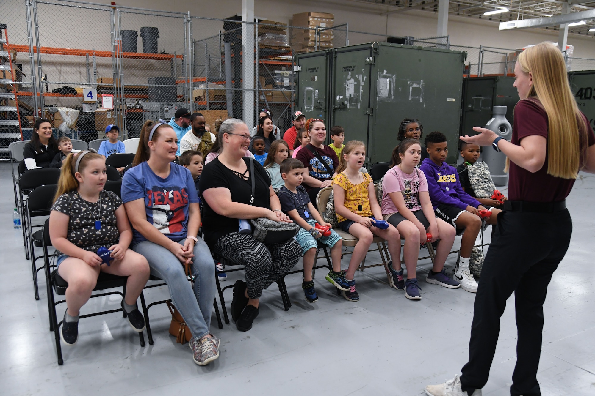 A U.S. Air Force Office of Special Investigations, Detachment 407, special agent provides a wing mission brief to Keesler families during Operation Hero at Keesler Air Force Base, Mississippi, March 4, 2023.