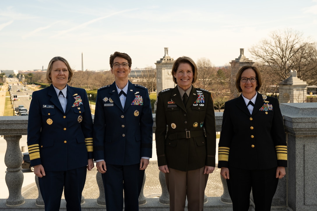 Left to right: U.S. Coast Guard Adm. Linda Fagan, Coast Guard commandant, U.S. Air Force Gen. Jacqueline Van Ovost, U.S. Transportation Command commander, U.S. Army Gen. Laura Richardson, U.S. Southern Command commander, and U.S. Navy Adm. Lisa Franchetti, vice chief of Naval Operations, meet for the first time before a Women's History Month panel discussion at the Military Women's Memorial in Arlington National Cemetery, Arlington, Va., March 6, 2023.