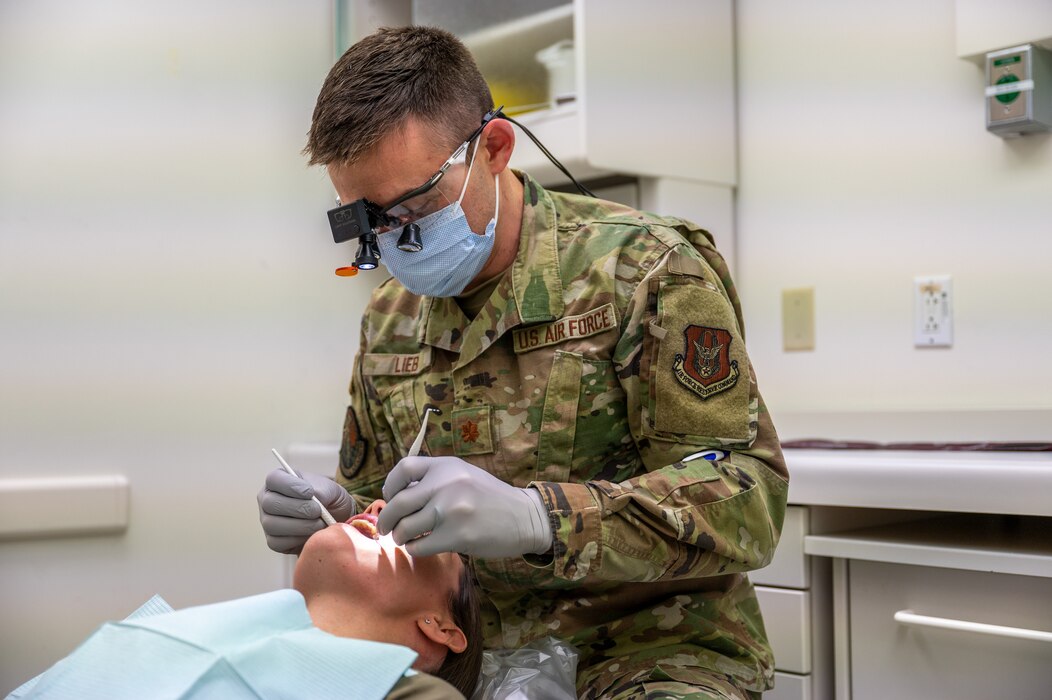 Image of an Airman doing a dental check.