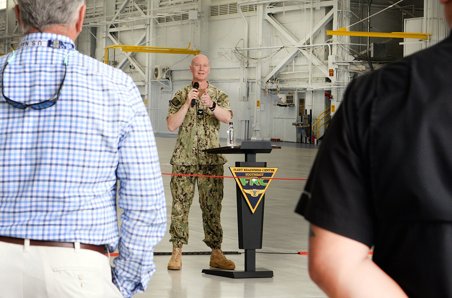 Capt. Grady Duffey, Fleet Readiness Center Southeast's (FRCSE) Commanding Officer, addresses an audience during Hangar 101 ribbon-cutting ceremony. The renovation upgraded the space to support current and next generation aircraft. (U.S. Navy Photo by Ashley Lombardo/Release)
