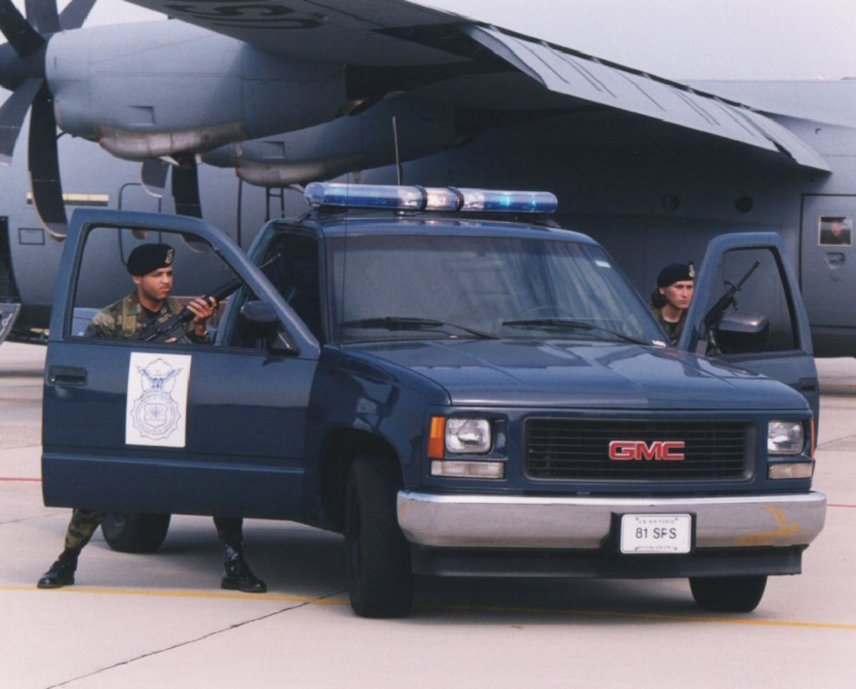 SF team at a vehicle guarding aircraft