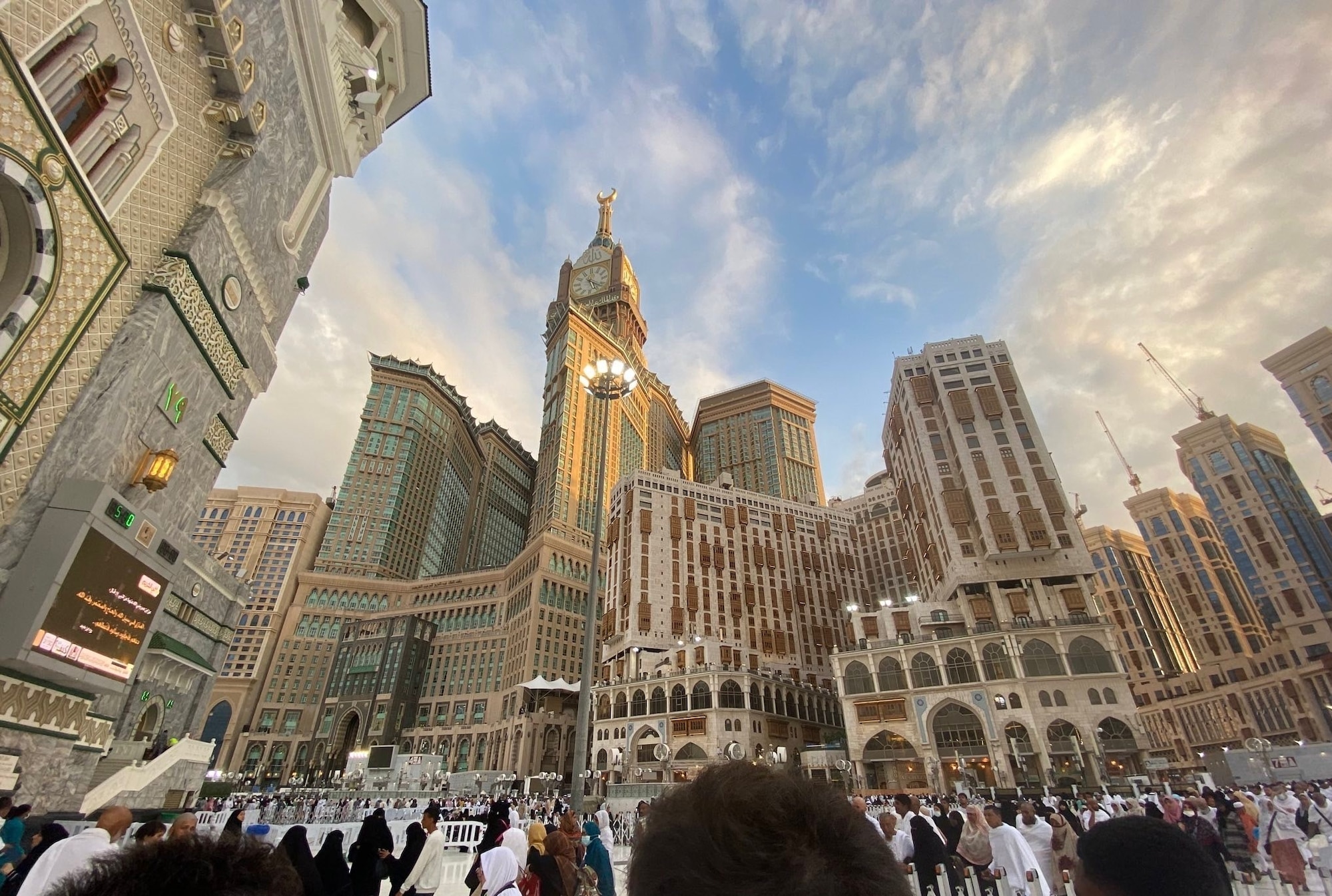The Abraj al-Bait towers seen from downtown Mecca, Saudi Arabia, Jan. 2023. The clock tower and various hotels are government-owned and were created to cater the pilgrims visiting the city. (Courtesy photo by Rashidaddin Shakirov)