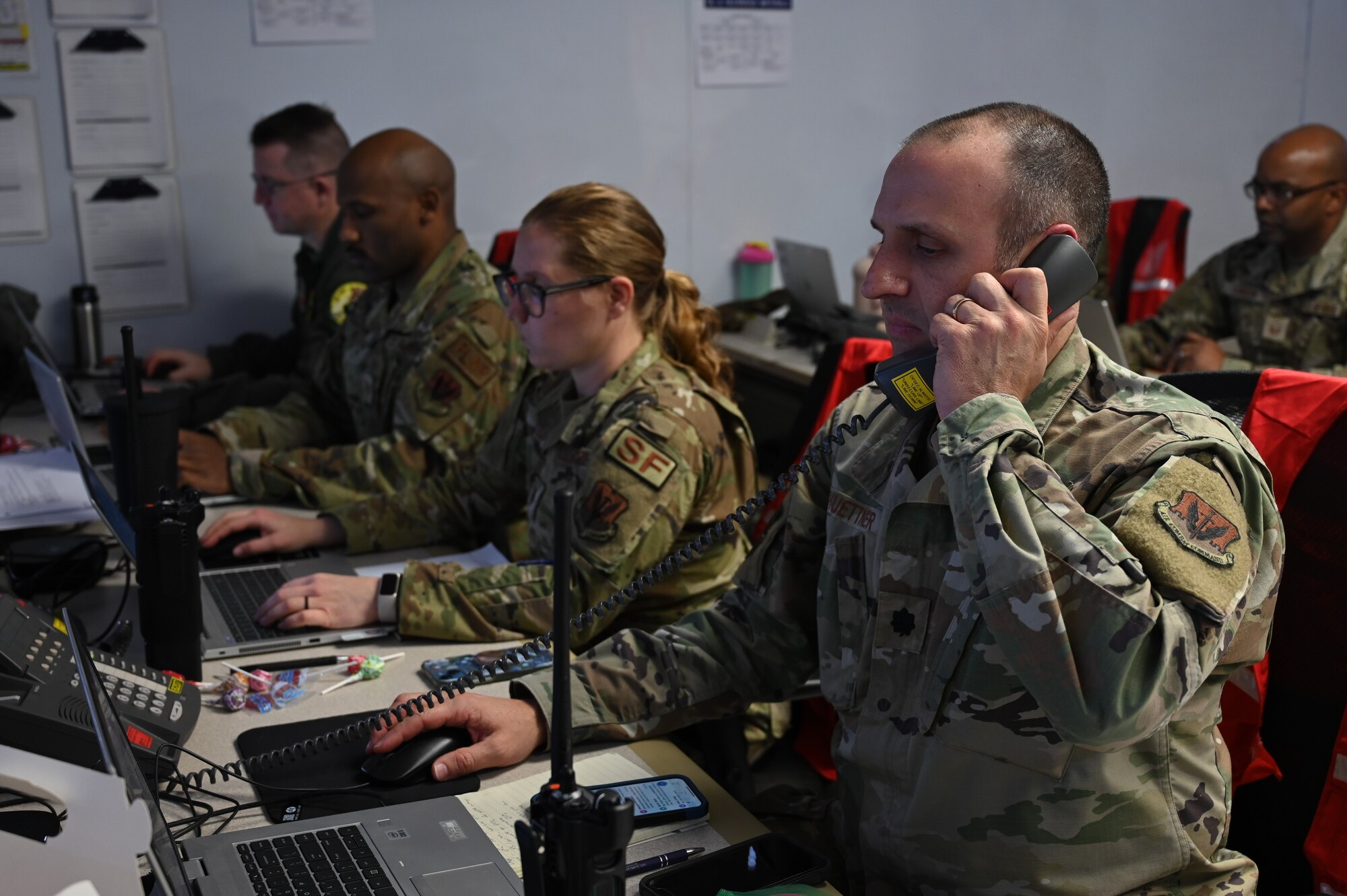 U.S. Air Force Lt. Col. Gary Huettner, 175th Communications Flight commander, answers the phone at Martin State Air National Guard Base, Middle River, Maryland, March 2, 2023.