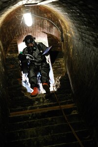 U.S. Army Staff Sgt. Cameron Hoover with the Idaho National Guard's 101st Civil Support Team climbs down crumbling steps  on Alcatraz Island, San Francisco, California, Feb. 23, 2022.  California's 95th CST hosted its annual emergency response exercise, BAY EX, with Idaho's 101st CST, Colorado National Guard's 8th CST, and first responders.