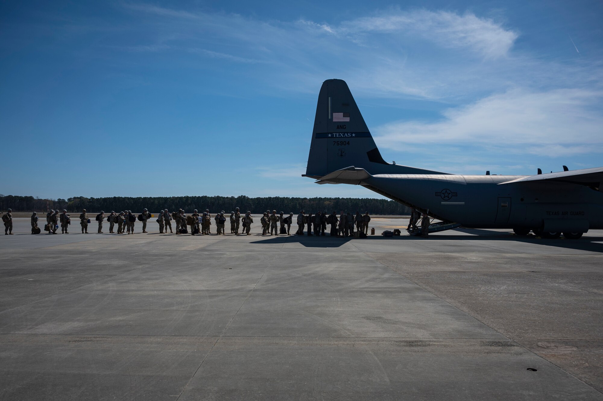 Airmen load a C-130