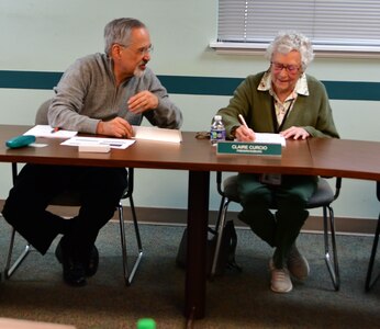 IMAGE: Naval Surface Warfare Center Dahlgren Division engineer Gregory Sokolowski (left) and Claire Curcio (right) talk while preparing for a recent board of directors meeting with the Rappahannock Area Community Services Board.