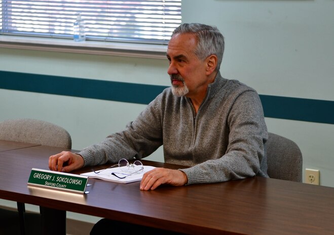 IMAGE: Naval Surface Warfare Center Dahlgren Division engineer Gregory Sokolowski listens intently during preparation for a recent board of directors meeting with the Rappahannock Area Community Services Board.