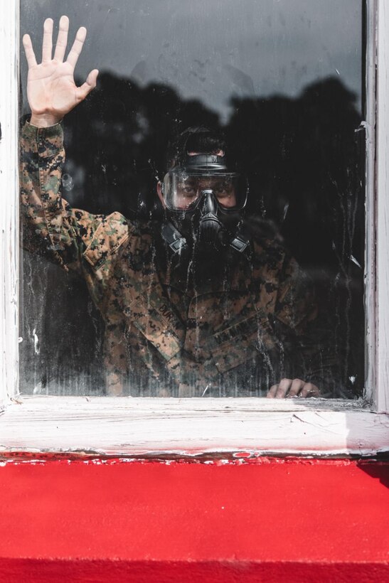 A U.S. Marine with Combat Logistics Regiment 27, 2nd Marine Logistics Group (2nd MLG), participates in annual gas chamber training event on Camp Lejeune, North Carolina, Feb. 23, 2023. 2nd MLG Marines conduct gas chamber training annually by exposing themselves to chlorobenzalmalononitrile tablets, commonly known as CS gas, in order to enhance their efficiency with the M50 gas mask and Mission Oriented Protective Posture gear. (U.S. Marine Corps photo by Cpl. Meshaq Hylton)