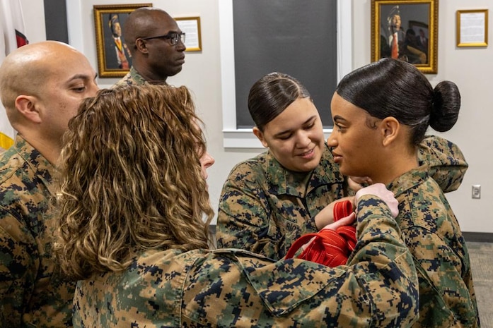 U.S. Marine Corps Lance Cpl. Rosana Monteiro, an inventory management specialist with 2nd Supply Battalion, 2nd Marine Logistics Group (MLG), is meritoriously promoted to the rank of Cpl. at the Montford Point Museum on Camp Johnson, North Carolina, March 2, 2023. Monteiro was meritoriously promoted to the rank of Cpl. after being named, 2nd MLG’s Marine of the Year for 2022. (U.S. Marine Corps Photo by Lane Cpl. Christian Salazar)