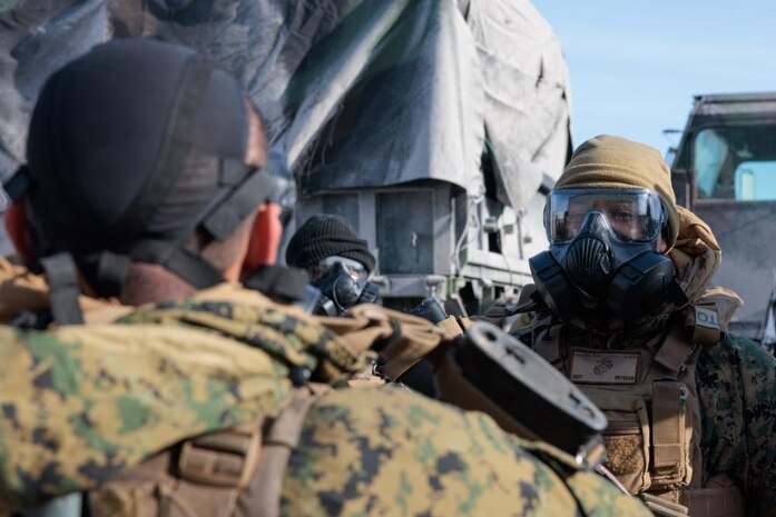 U.S. Marines with 2nd Landing Support Battalion (LSB), Combat Logistics Regiment 27, 2nd Marine Logistics Group, conduct a gear check during a simulated chemical biological radiological and nuclear (CBRN) attack on Fort Drum, New York, March 3, 2023. Marines with 2nd LSB conduct a CBRN exercise to sustain and enhance their support capabilities in an austere environment. (U.S. Marine Corps photo by Lance Cpl. Mary Kohlmann)