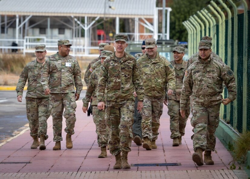A group of soldiers walk together.
