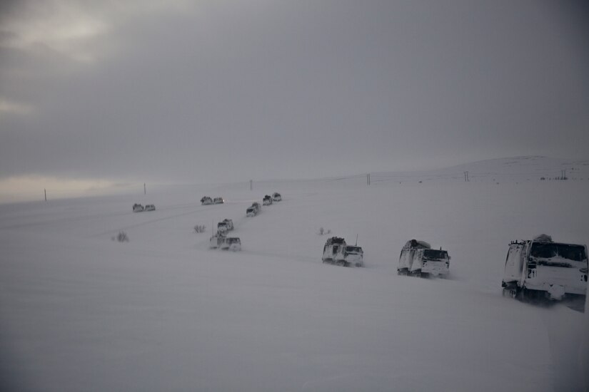 Marine drive vehicles in snowy mountains.