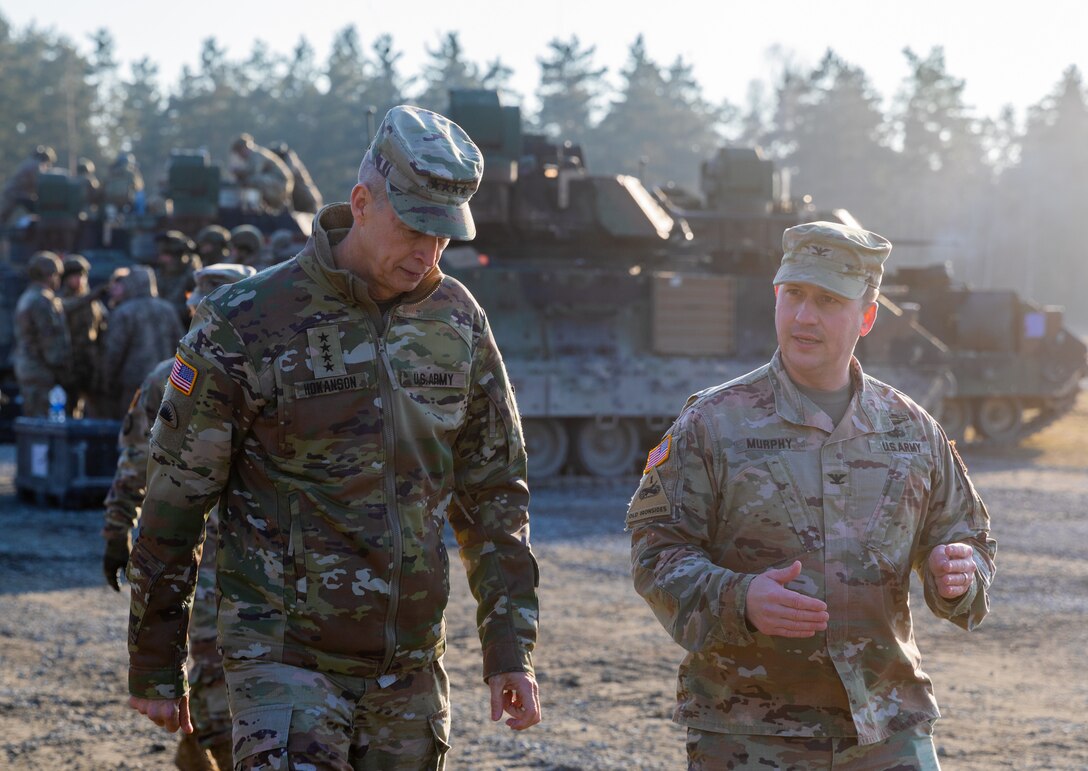 U.S. Army Gen. Daniel Hokanson, chief of the National Guard Bureau, speaks with Col. William Murphy, commander of Task Force Orion, 27th Infantry Brigade Combat Team, New York Army National Guard, at a training site for the M2 Bradley Fighting Vehicle in Grafenwoehr, Germany, March 1, 2023. Hokanson visited Task Force Orion, which is deployed to lead the Joint Multinational Training Group – Ukraine, and helps facilitate training of the Ukrainian Armed Forces in Germany as part of a worldwide effort led by the United Stated and supported by more than 50 nations to help Ukraine defend itself from Russia’s brutal and unprovoked war.