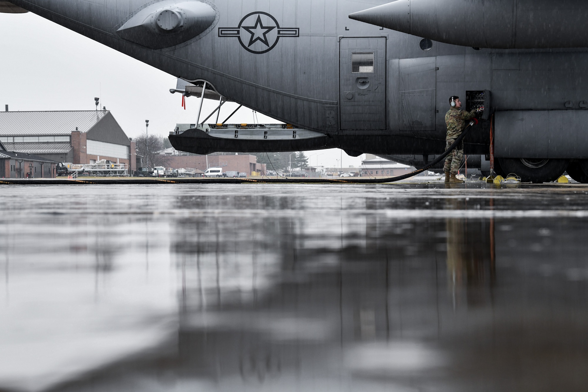 Senior Airman Creston Shirey, an aerospace maintenance journeyman assigned to the 910th Aircraft Maintenance Squadron, refuels a C-130H Hercules on Feb. 16, 2023, on the flight line at Youngstown Air Reserve Station, Ohio.