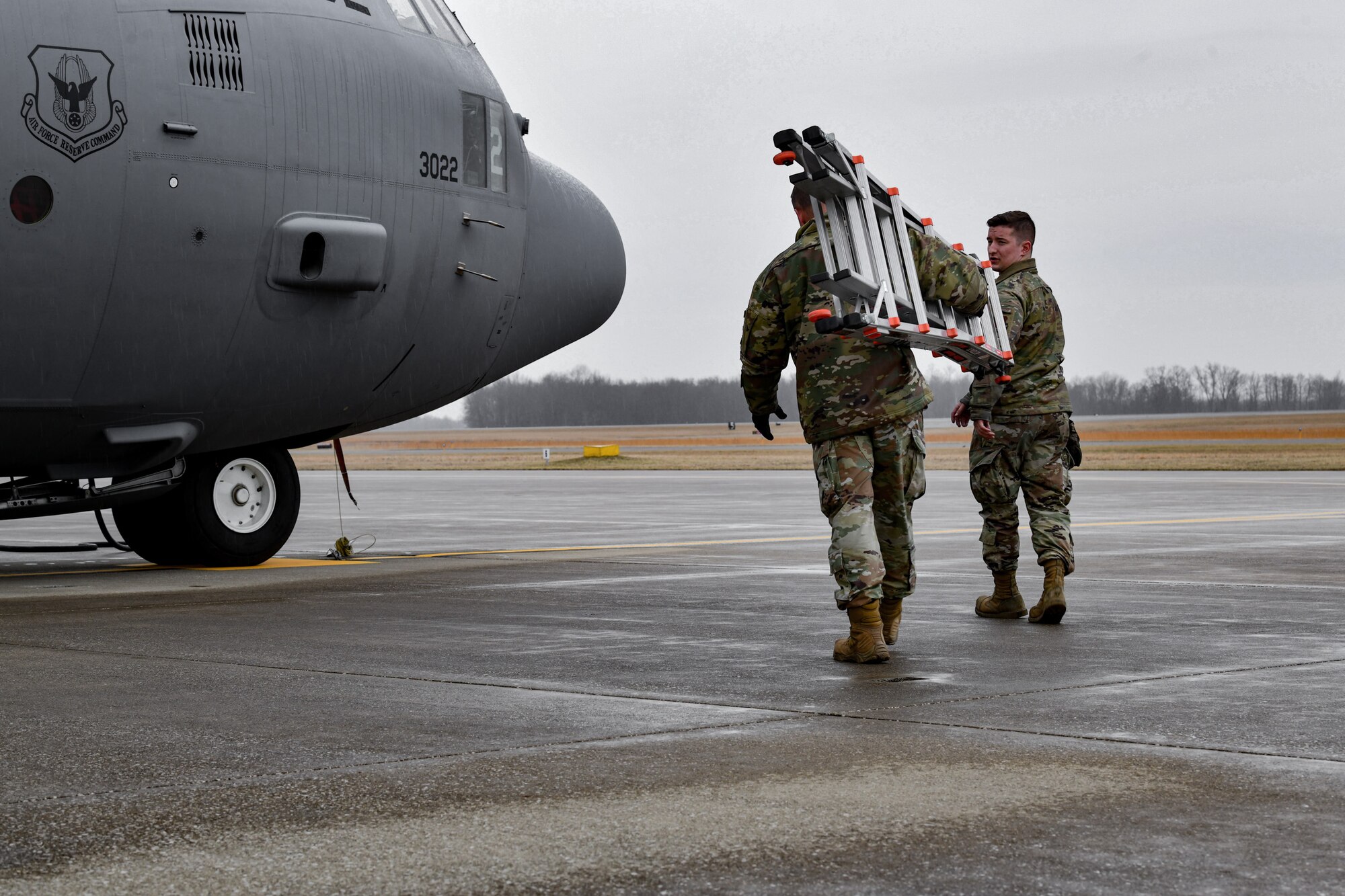 Master Sgt. Gerald Christy, an aircraft maintenance craftsman assigned to the 910th Aircraft Maintenance Squadron, and Senior Airman Creston Shirey, an aerospace maintenance journeyman assigned to the 910th AMXS, perform routine maintenance checks on Feb. 16, 2023, at Youngstown Air Reserve Station, Ohio.