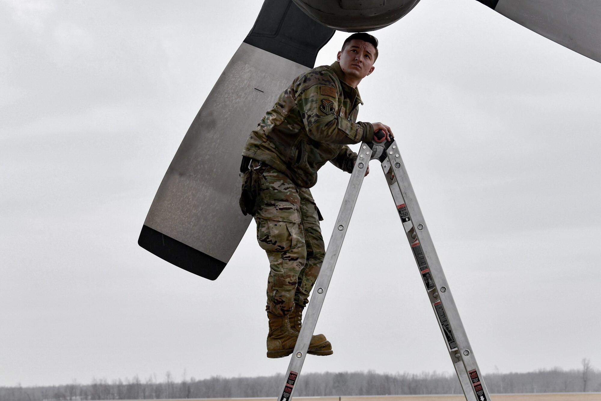 Senior Airman Creston Shirey, an aerospace maintenance journeyman assigned to the 910th Aircraft Maintenance Squadron, performs routine maintenance checks on Feb. 16, 2023, on the flight line at Youngstown Air Reserve Station, Ohio.