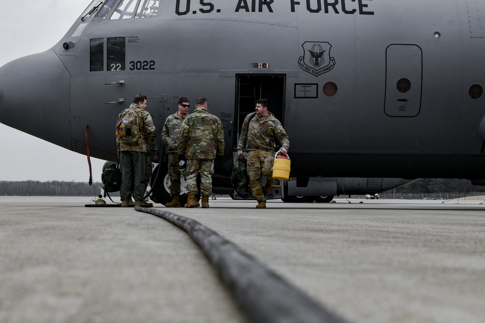 An aircrew assigned to the 757th Airlift Squadron exits a C-130H Hercules aircraft on the flight line on Feb. 16, 2023, at Youngstown Air Reserve Station, Ohio.