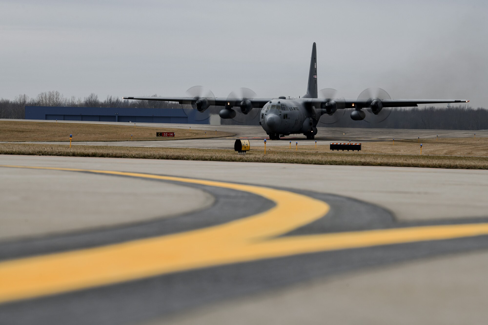 An aircrew assigned to the 757th Airlift Squadron taxis a C-130H Hercules aircraft to the flight line on Feb. 16, 2023, at Youngstown Air Reserve Station, Ohio.
