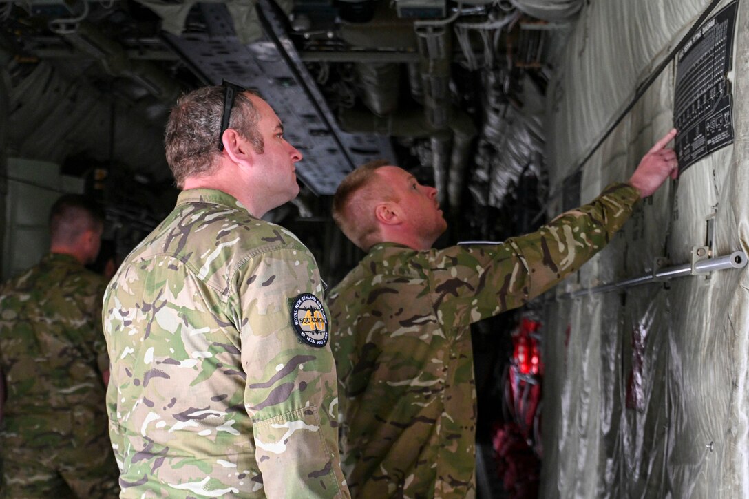 aircrew walk through a C-130J