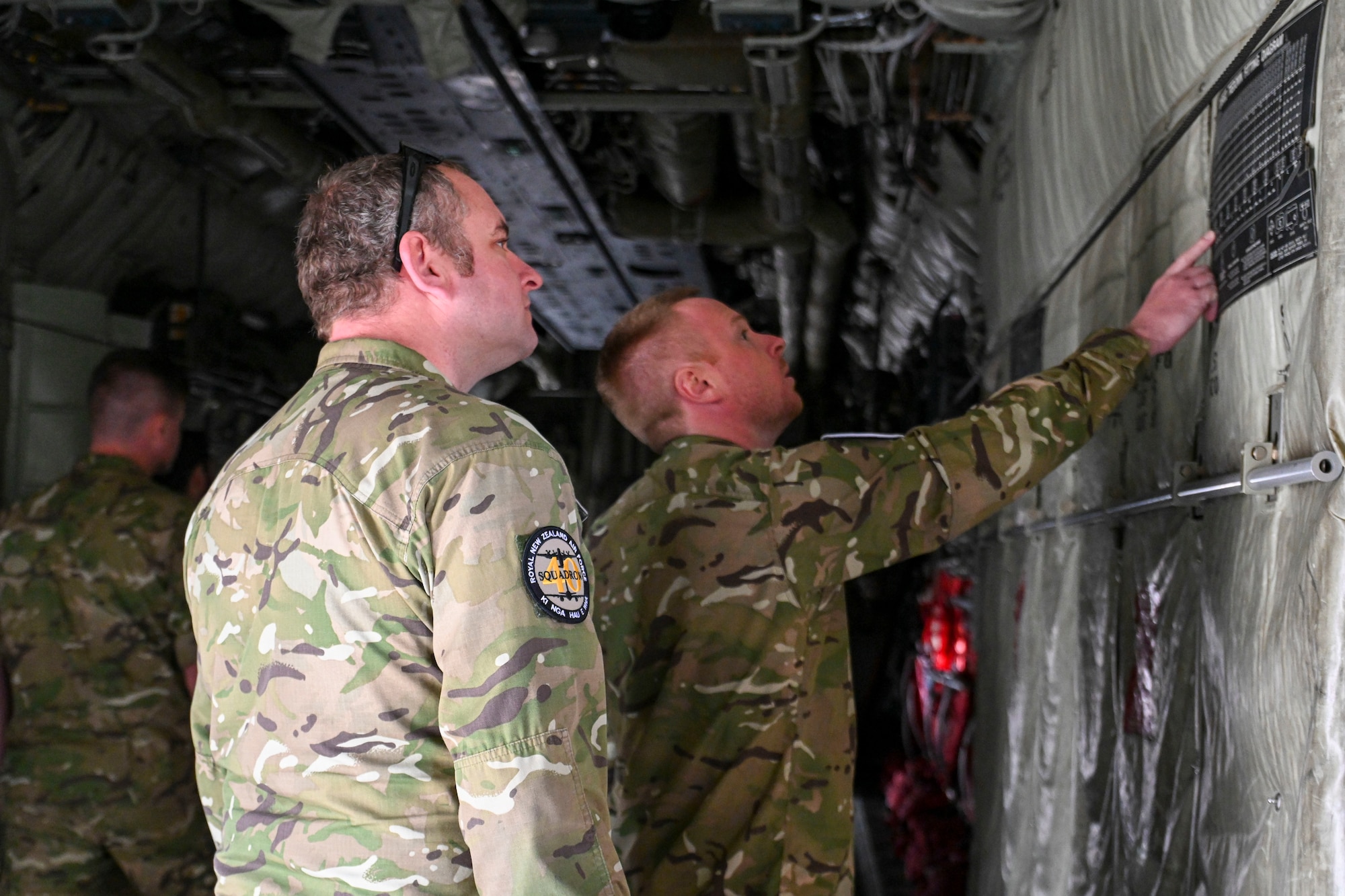 aircrew walk through a C-130J