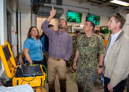 (center) Naval Sea Systems Command 00C38 Diving Systems Program Manager Paul McMurtrie briefs Capt. David Back, NSWC PCD commanding officer, and (right) Dr. Kerry Commander, NSWC PCD Chief Technology Office, SSTM, on several of the new concept suit capabilities during the Deep Sea Expeditionary with No Decompression Suit In-Water Concept Demonstration held at the U.S. Navy Experimental Diving Unit, Feb. 7 – 8. One of this program’s objectives is to develop a swimmable dive suit that maintains a specific atmospheric pressure internal to the suit up to 300 feet of seawater and further development could enable it to greater depths. (U.S. Navy photo by Ronnie Newsome)