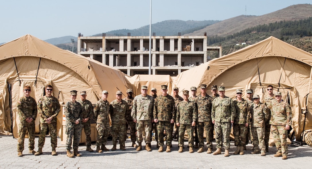 Members of Task Force 61/2, U.S. Sixth Fleet, U.S. Naval Forces Europe and leadership from the 39th Air Base Wing pose for a photo at Antakya, Türkiye, March 2, 2023. At the request of the Turkish government, U.S. military personnel assigned to Task Force 61/2 and 39th Air Base Wing were tasked with building a field hospital for the citizens who were affected by the Feb. 6 earthquakes. Upon completion of their efforts on March 2, 2023, leaders from Task Force 61/2, and 39th Air Base Wing conducted a final walk-through before the Turkish Ministry of Health began operations at the field hospital.