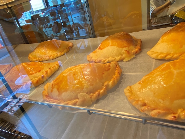 Golden brown empanadas on display at Rock-N-Roll burrito, a family-owned Mexican cantina-style establishment located near Naval Air Facility Atsugi. ‘Hecho Con Mucho Amor,’ or ‘Made with immense love’ in Spanish, is painted above the entranceway to the kitchen, and embodies the mission of owner Hajime Higa, a Peru native and long-time Japanese resident, whose goal is to provide freshly made Mexican cuisine for U.S. servicemembers and their families with as much love and care as possible.