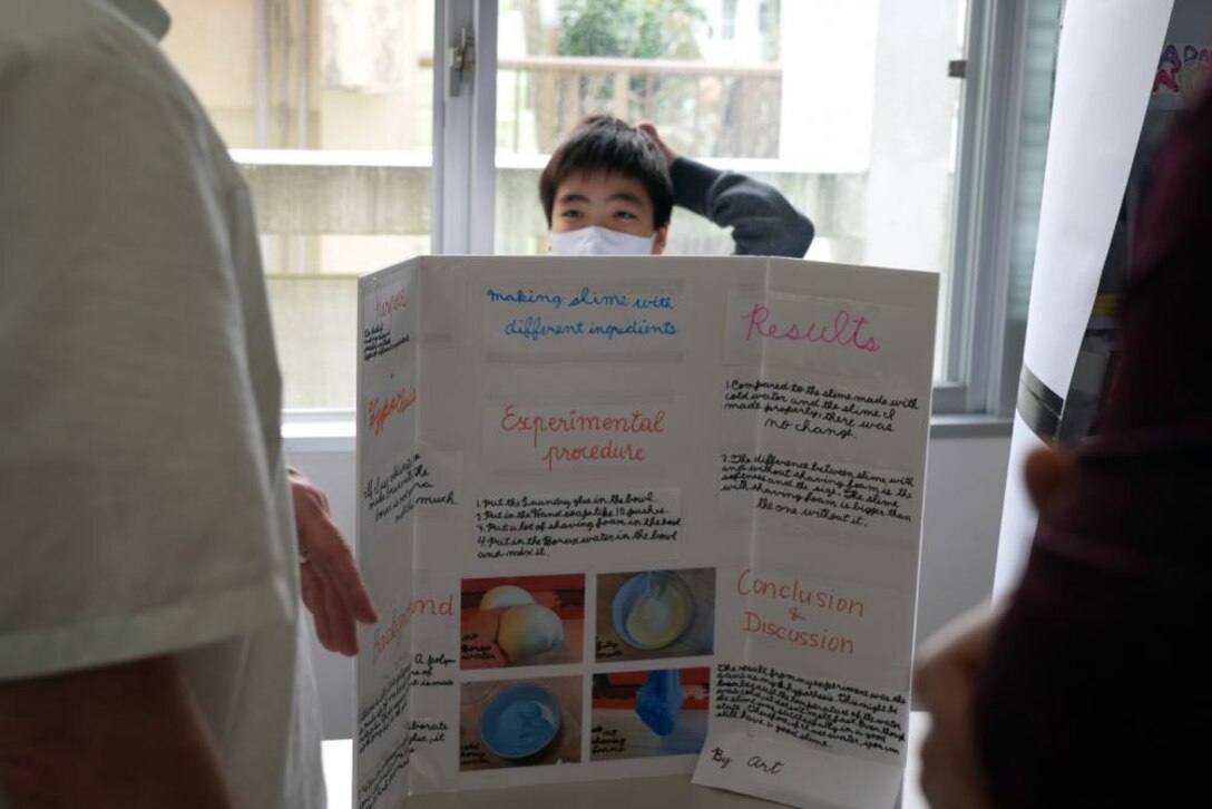 JED representatives Dr. Rex Mols, OAO’s Host Nation Branch Chief, and Brian Ciccocioppo, Resident Engineer of Okinawa’s Torii Office, judge a science fair being held at the AmerAsia school in Okinawa. The school is home to 63 students, most being half Japanese and half American. The two Engineers have volunteered their own time to encourage interest in science, technology, engineering, and math (STEM) at the local school as a way of giving back to the local Okinawan community.