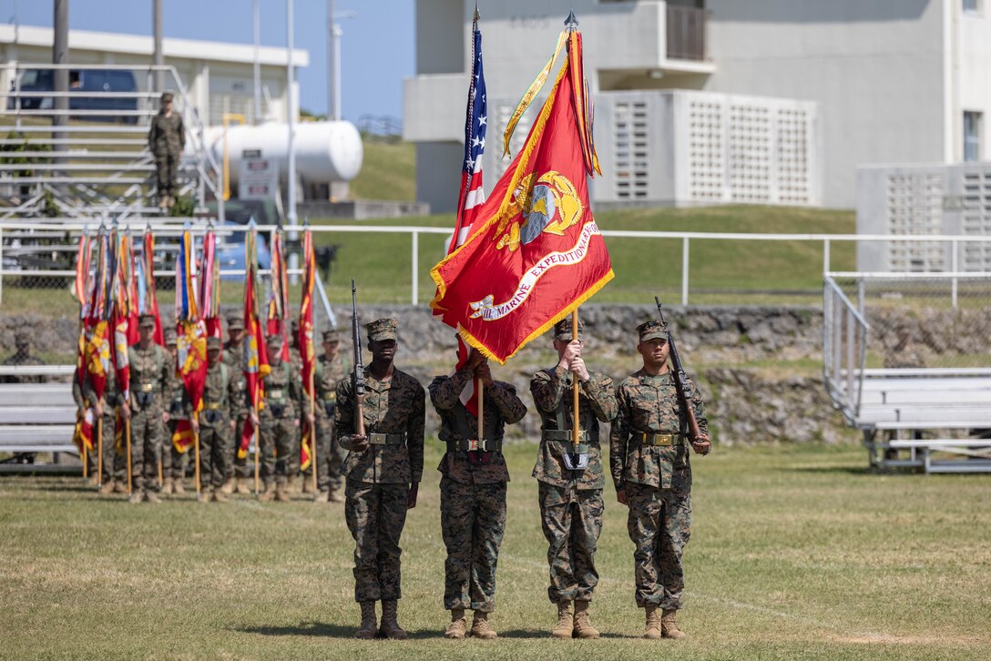 U.S. Marines with III Marine Expeditionary Force present the colors at a relief and appointment ceremony on Marine Corps Base Camp Butler, March 7, 2023. Sgt. Maj. Eric D. Cook relinquished his duties as sergeant major of III MEF, and sergeant major of Marine Forces Japan to Sgt. Maj. Joy M. Kitashima. (U.S. Marine Corps photo by Cpl. Diana Jimenez)