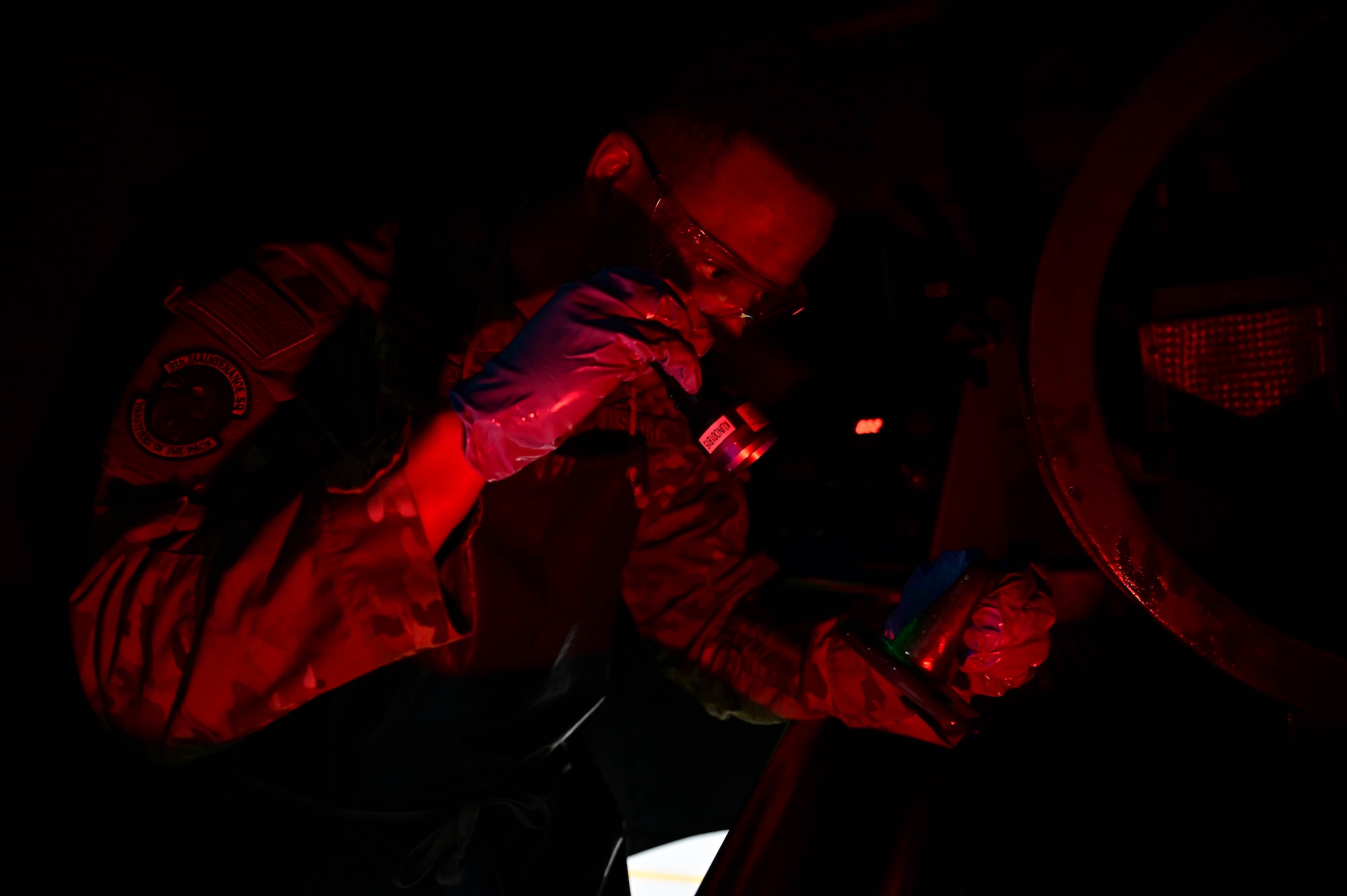 Airman 1st Class Jaylin Tripp, 8th Maintenance Squadron nondestructive inspection specialist, examines a piece of aircraft equipment at Kunsan Air Base, Republic of Korea, Mar. 6, 2023.