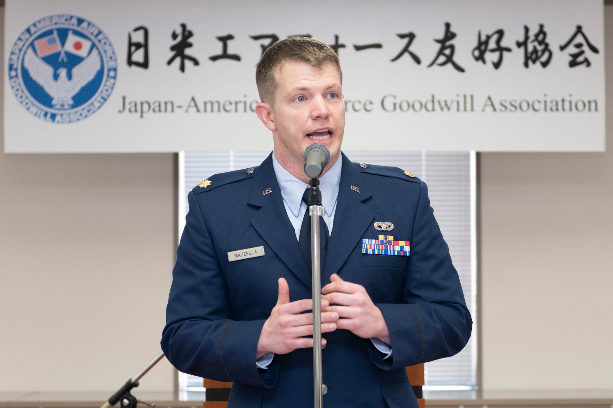 Maj. Lance Mazzella, 374th Logistics Readiness Squadron director of operations, gives a speech after accepting the Japan-America Air Force Goodwill Association Award, March 3, 2023, at Yokota Air Base, Japan.