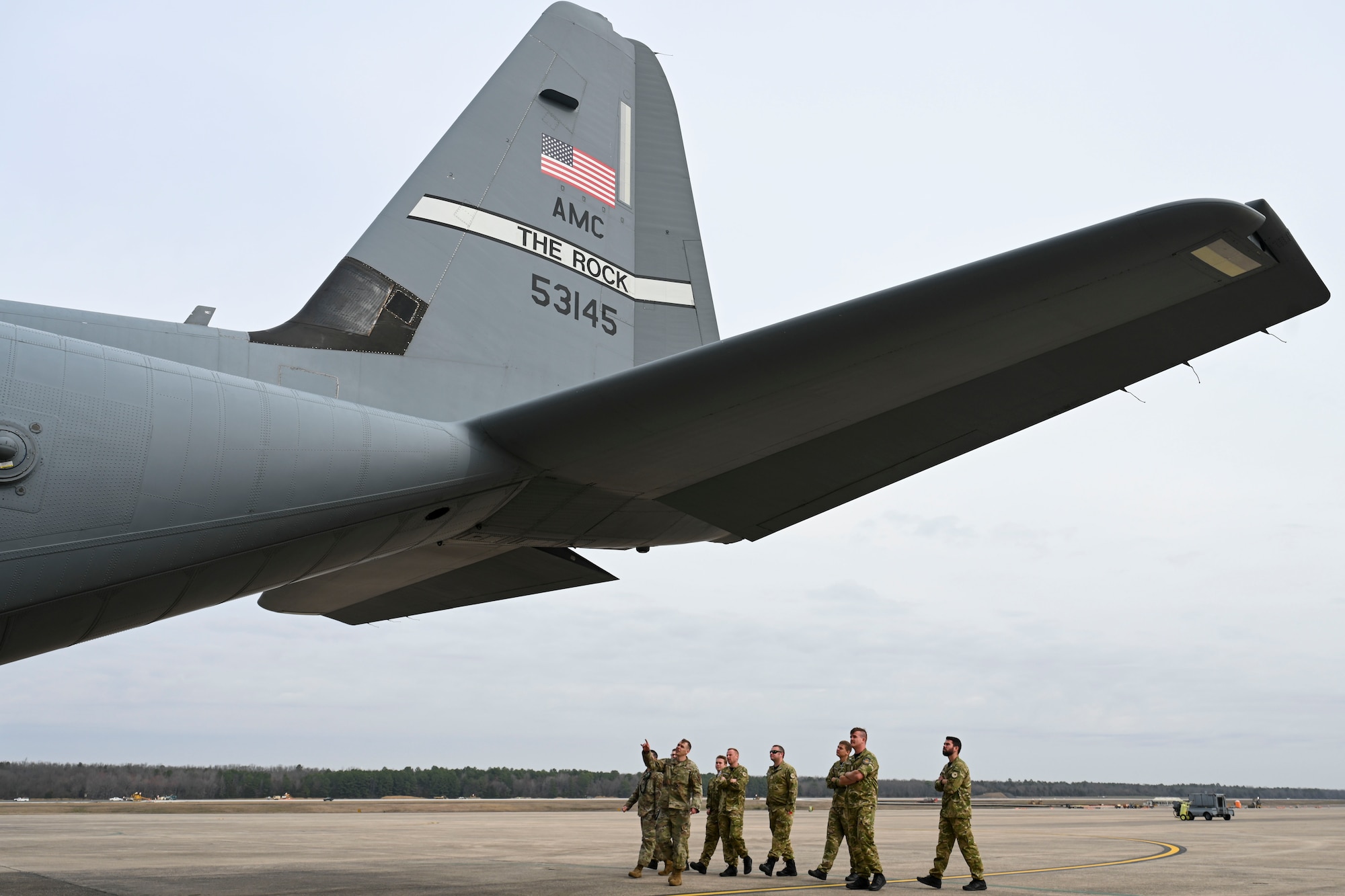 aircrew walk around a C-130J