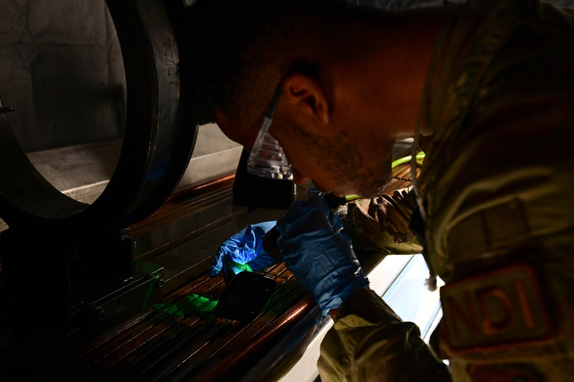 Airman 1st Class Jaylin Tripp, 8th Maintenance Squadron nondestructive inspection specialist, performs magnetic particle inspection on a piece of aircraft equipment at Kunsan Air Base, Republic of Korea, Mar. 6, 2023.