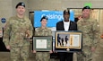 Photo of Tobyhanna Army Depot Commander Colonel Daniel L. Horn, then-Depot Sergeant Major Michael J. Wiles and AUSA Tobyhanna Chapter President Kelvin Spencer present the Warfighter of the Quarter award to Sergeant Megan Kennedy.